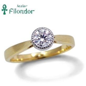 【アトリエフィロンドール】【アトリエ・フィロンドール】ベゼルセッティングのダイアモンドとミル打ち、ゴールドが魅力のエンゲージリング