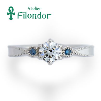【アトリエフィロンドール】【アトリエ・フィロンドール】ダイヤとブルーダイヤにミル打ちが際立つ婚約指輪